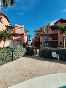 a patio in front of some apartment buildings at Mar Menor Golf Resort, Fitnes, Tennis, wellness, Security! in Torre-Pacheco