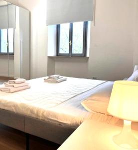 Letto o letti in una camera di Duomo a 8 min - Centro, Qc Terme, 2 camere