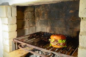 a sandwich cooking on a grill in an oven at La CASITA BOUTIQUE VILLA DE LEYVA in Villa de Leyva +30 photos
