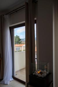 a room with a window and a fish tank in front of a mirror at Rokani Studio II at Kalavrita Center in Kalavrita +19 photos