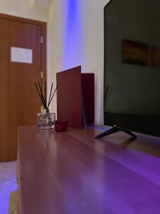 تلفاز و/أو أجهزة ترفيهية في Hotel Il Giardino degli Aranci
