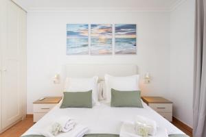 Ένα ή περισσότερα κρεβάτια σε δωμάτιο στο Eden Rentals Beach Paradise +26 φωτογραφίες