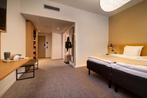 Katil atau katil-katil dalam bilik di Radisson Hotel Papirfabrikken Silkeborg