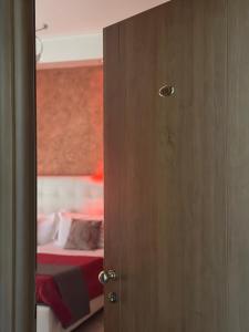 سرير أو أسرّة في غرفة في Hotel Il Giardino degli Aranci