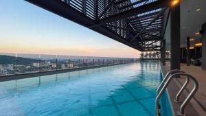 a large swimming pool on top of a building at 10 Mossaz skypool 5mins to 1U and Ikea atEmpire City by Light House in Petaling Jaya