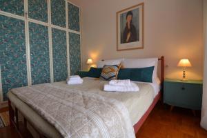 a bedroom with a bed with two towels on it at Apricot House in Kavála