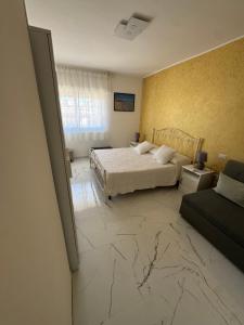Postel nebo postele na pokoji v ubytování B&B Ancora del Sud