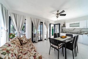a living room with a couch and a table at Seaside Holiday Home Ema in Vela Luka +39 photos