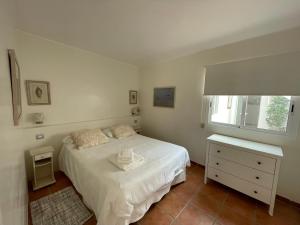 Postel nebo postele na pokoji v ubytování Villa René Beach