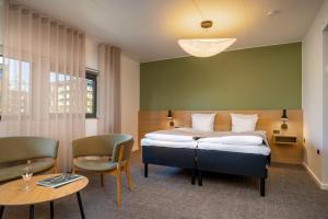 Katil atau katil-katil dalam bilik di Radisson Hotel Papirfabrikken Silkeborg