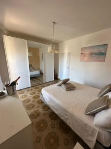 a bedroom with a large bed in a room at Greta Apartment Tropea in Tropea