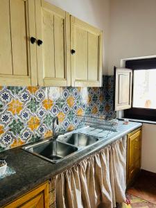 Kuchyňa alebo kuchynka v ubytovaní Sikelia Apartment