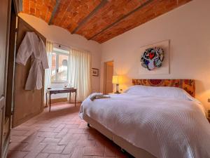 Postel nebo postele na pokoji v ubytování Il Senatore - Chianti Villa & Pool