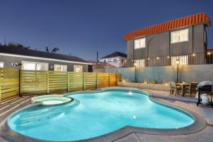 a swimming pool in the backyard of a house at Studio 3 Min to Downtown Beaches Freeways Airport in San Diego