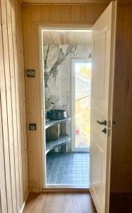 a door leading into a room with a doorway at Northern lights in Inari