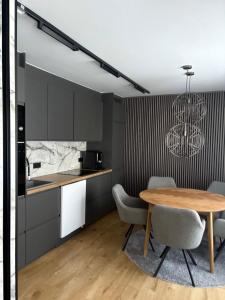 a kitchen and dining room with a table and chairs at Northern lights in Inari