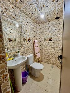 a bathroom with a toilet and a sink at Lovers Apart - Calm & Bright in Essaouira