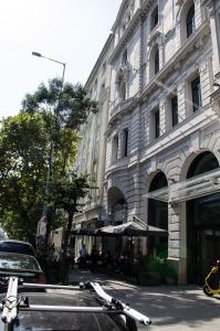 a bike parked in front of a building at Blue Luxury Apartment in Budapest