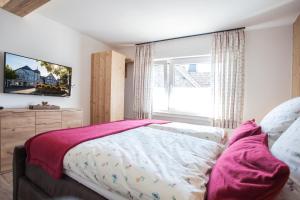 Postel nebo postele na pokoji v ubytování Haus Jungmann