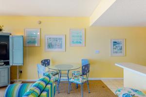 a dining room with a table and chairs at Majestic Sun B0206 in Destin
