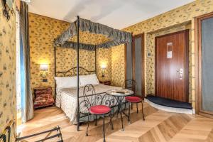 Postel nebo postele na pokoji v ubytování Residenza Ave Roma