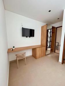TV a/nebo společenská místnost v ubytování Hotel macana villavicencio