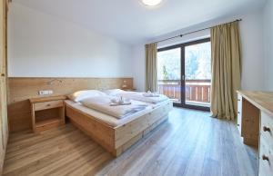 Life & Luxury Appartements tesisinde bir odada yatak veya yataklar