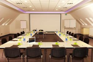 a large conference room with a long table and chairs at Hotel sleep & go in Bad Hersfeld