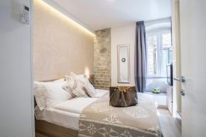 Postel nebo postele na pokoji v ubytování Centro di Centri Rooms