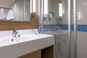 Salle de bains dans l'établissement Scandic Grand Marina