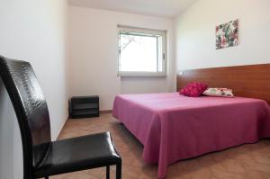 En eller flere senge i et værelse på Villetta Kair 260