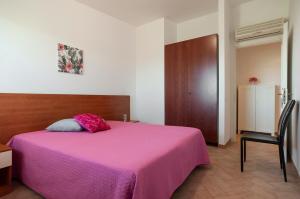 En eller flere senge i et værelse på Villetta Kair 260