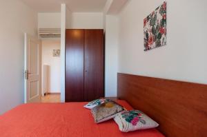 En eller flere senge i et værelse på Villetta Kair 260