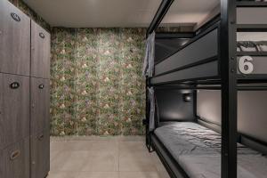 a bedroom with two bunk beds and a wallpaper at Bed in mixed room Hippie Nice in Mexico City +37 photos