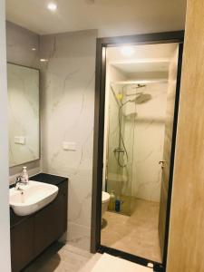 a bathroom with a sink and a shower at Agile Dream House Bukit Bintang TRX in Kuala Lumpur