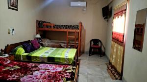 a bedroom with two bunk beds in a room at Residencial Guadalupe in Termas de Río Hondo