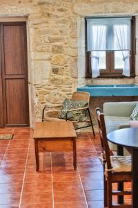 A seating area at Apartamentos Arnela Még 27 kép