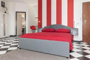 Giường trong phòng chung tại La Mansarda del Principe, vicoli, acquario e lanterna