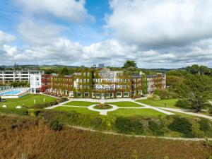 an aerial view of a building with a park at The Carlyon Bay Hotel and Spa in St Austell