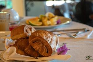 a plate of pastries sitting on a table at Le Relais de la Reine de l'Isalo in Ranohira +7 photos