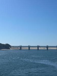 a bridge in the middle of a body of water at Ancoravilla in Vila Praia de Âncora +7 photos