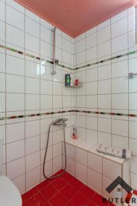 a white tiled bathroom with a shower and a sink at Eco Friendly Country Home in Kókkinos Pírgos +41 photos