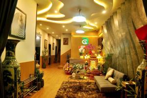 a living room with a couch and a table at Gori Hotel in Danang