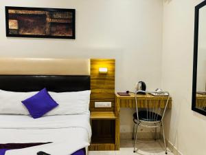 Postel nebo postele na pokoji v ubytování Hotel Liwa Inn - By AVK Near NESCO