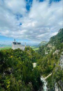 an aerial view of a castle on top of a mountain at Boutique Haus Sissi in Füssen