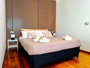 Postel nebo postele na pokoji v ubytování le dimore di Magda suite & rooms