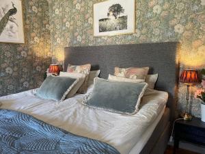 a bed with two pillows on it in a bedroom at Bärsta BnB in Kolbäck