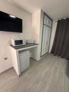 Kuchyň nebo kuchyňský kout v ubytování Hostal Los Mellizos