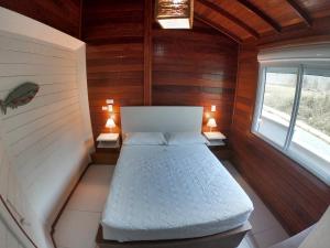 Katil atau katil-katil dalam bilik di Apartamento com vista para o mar da Gamboa SC