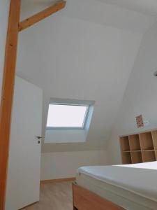 Postel nebo postele na pokoji v ubytování Gite des 3 cigognes